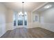 Dining room with natural light with modern light fixture at 2545 Davenport Park Dr, Duluth, GA 30096
