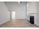 Open living room featuring high ceilings, fireplace, and large windows for natural light at 2545 Davenport Park Dr, Duluth, GA 30096