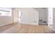 Bright living area with hardwood floors, stairs and neutral paint at 2545 Davenport Park Dr, Duluth, GA 30096