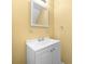 Bathroom features a white vanity, a framed mirror, and a silver towel rack at 3188 Sunnyford Ln, Lithonia, GA 30038