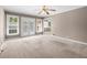 Carpeted bedroom with natural light from windows and doors leading to an outdoor area at 3188 Sunnyford Ln, Lithonia, GA 30038
