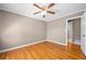 Bedroom with hardwood floors, neutral walls, and a ceiling fan at 3188 Sunnyford Ln, Lithonia, GA 30038