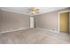 Neutral bedroom featuring a ceiling fan, carpet flooring, and white trim at 3188 Sunnyford Ln, Lithonia, GA 30038