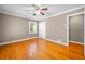 Bedroom featuring a closet, hardwood floors, neutral walls, and white trim at 3188 Sunnyford Ln, Lithonia, GA 30038