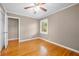 Bedroom with hardwood floors, a closet, and natural light at 3188 Sunnyford Ln, Lithonia, GA 30038