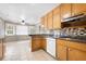Well-lit kitchen featuring tile floors, neutral countertops, and an adjacent breakfast nook at 3188 Sunnyford Ln, Lithonia, GA 30038