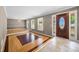 Inviting living room featuring unique floors, ample natural light, and a decorative chandelier at 3188 Sunnyford Ln, Lithonia, GA 30038
