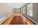 Spacious living area with abundant natural light, unique flooring, and elegant chandelier at 3188 Sunnyford Ln, Lithonia, GA 30038