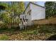 Backyard view showing a tiered deck and a grassy, partially wooded lot at 507 Matthew Dr, Canton, GA 30115