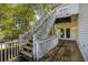 Exterior view of a deck with weathered wooden planks, stairs, and siding at 507 Matthew Dr, Canton, GA 30115