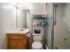 Tiled bathroom features a vanity, toilet, and a glass-enclosed shower at 507 Matthew Dr, Canton, GA 30115