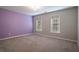 Spacious bedroom featuring carpet, natural light, and two-tone walls at 507 Matthew Dr, Canton, GA 30115