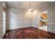 Traditional dining room with gleaming hardwood floors and views to the adjacent kitchen at 507 Matthew Dr, Canton, GA 30115