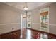 The dining room features gleaming hardwood floors, neutral paint, and large windows for great natural light at 507 Matthew Dr, Canton, GA 30115