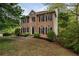 Charming two-story brick home with black shutters and manicured landscaping at 507 Matthew Dr, Canton, GA 30115