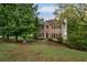 Traditional brick home with a well-maintained lawn and mature trees, offering curb appeal at 507 Matthew Dr, Canton, GA 30115