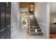 Grand two-story foyer with stairs and tile flooring leading into other rooms of the home at 507 Matthew Dr, Canton, GA 30115