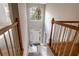 Bright foyer with staircase, chandelier, and natural light streaming through the front door at 507 Matthew Dr, Canton, GA 30115