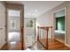 View of foyer with staircase, wood floors, and decorative chandelier at 507 Matthew Dr, Canton, GA 30115