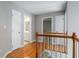 Hallway with wood floors and multiple doorways provides seamless access to other rooms at 507 Matthew Dr, Canton, GA 30115