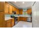 Spacious kitchen with wooden cabinets, modern appliances, and ample counter space for cooking at 507 Matthew Dr, Canton, GA 30115