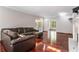 Spacious living room featuring gleaming hardwood floors, fireplace, and comfortable seating at 507 Matthew Dr, Canton, GA 30115