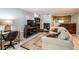 A spacious living area integrates a comfortable seating arrangement with a functional workspace at 507 Matthew Dr, Canton, GA 30115