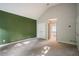 Spacious main bedroom with vaulted ceiling, carpet, and en-suite bathroom at 507 Matthew Dr, Canton, GA 30115