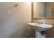 Clean powder room with pedestal sink, gold hardware, and neutral paint palette at 507 Matthew Dr, Canton, GA 30115