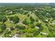 Expansive aerial view of a rural landscape featuring lush greenery, scattered homes, and tranquil surroundings at 5711 Parks Rd, Cumming, GA 30041