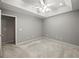 Spacious bedroom featuring neutral colors and plush carpet at 5711 Parks Rd, Cumming, GA 30041