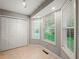 Bright entryway with tile flooring, multiple windows letting in natural light, and a closet for storage at 5711 Parks Rd, Cumming, GA 30041