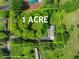 Aerial view of the house on a 1 acre parcel, highlighting the lot size and green surroundings at 5711 Parks Rd, Cumming, GA 30041