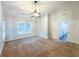 A neutral bedroom features carpet, a ceiling fan, and bright windows at 6815 Fairgreen Dr, Suwanee, GA 30024