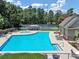 Community pool and tennis court with lounge chairs, perfect for relaxing and enjoying outdoor recreation at 6815 Fairgreen Dr, Suwanee, GA 30024