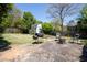 Landscaped backyard with stone patio, outdoor seating, and a grilling area perfect for entertaining at 812 E Ponce De Leon Ave, Decatur, GA 30030