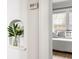Cozy bedroom features a decorative wall niche with a plant and a glimpse of the bed at 812 E Ponce De Leon Ave, Decatur, GA 30030