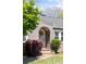 Close up of the arched front door entrance with a wreath and surrounding greenery at 812 E Ponce De Leon Ave, Decatur, GA 30030