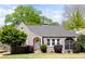 Charming home with a gray brick exterior, arched entryway, and a well-maintained front lawn at 812 E Ponce De Leon Ave, Decatur, GA 30030