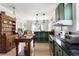 View of a kitchen and dining area with an island and lots of cabinet space at 812 E Ponce De Leon Ave, Decatur, GA 30030