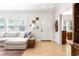 Bright living room with hardwood floors, white walls, and arched doorway at 812 E Ponce De Leon Ave, Decatur, GA 30030