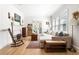 Cozy living room features a fireplace, hardwood floors, a comfortable sectional, and natural light at 812 E Ponce De Leon Ave, Decatur, GA 30030