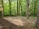 Large partially cleared backyard backing to a beautiful wooded area at 2065 Verbena St, Atlanta, GA 30314