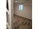 Basement area featuring wood-look flooring and a small window at 2065 Verbena St, Atlanta, GA 30314
