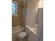 Cozy bathroom featuring a shower-tub combo, decorative tile surround, and modern vanity at 2065 Verbena St, Atlanta, GA 30314