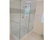 Modern bathroom featuring a glass-enclosed shower with white tile and a mosaic accent at 2065 Verbena St, Atlanta, GA 30314