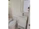 Bathroom vanity with sink, toilet and mirror at 2065 Verbena St, Atlanta, GA 30314