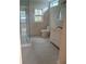 Bathroom with a shower, toilet, and vanity with white cabinets at 2065 Verbena St, Atlanta, GA 30314