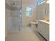Bathroom featuring a shower, toilet, and vanity with drawers at 2065 Verbena St, Atlanta, GA 30314