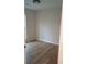 Bright bedroom featuring wood-look flooring and a modern ceiling light at 2065 Verbena St, Atlanta, GA 30314